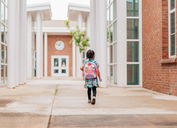 Diverse mixed race pre school age girl heading back to school after summer break