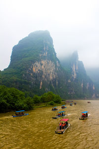 Scenic view of boats in bay