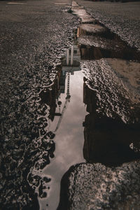 High angle view of rocks by sea