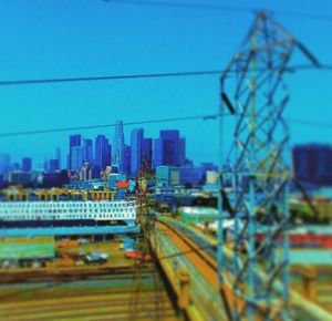 View of cityscape against blue sky