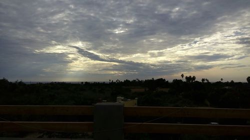 Scenic view of landscape against cloudy sky