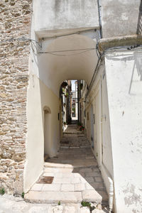 A narrow street among the old houses of irsina in basilicata, region in southern italy.