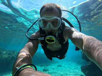 Man diving under sea