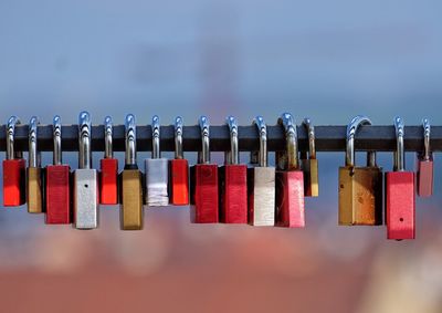 Close-up of padlocks on metal fence