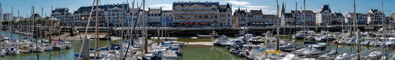 Panoramic view of bridge over canal amidst buildings in city