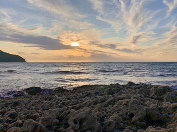 Scenic view of sea against sky during sunset