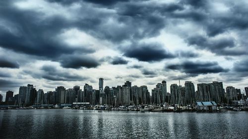 City skyline against cloudy sky