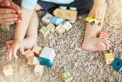 High angle view of child playing with toy blocks