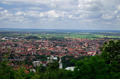 Aerial view of town against sky