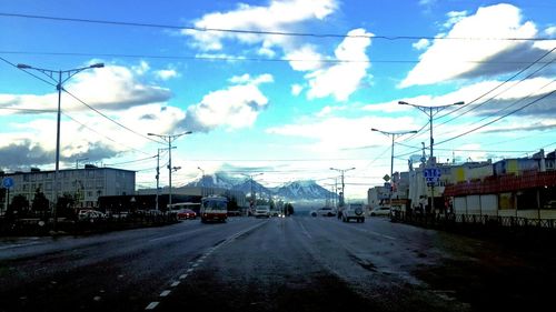 Railroad track against cloudy sky