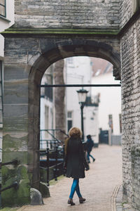 Full length of a man walking in front of building