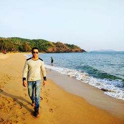 Portrait of man standing on beach