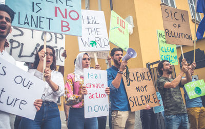 People with banners protesting in city