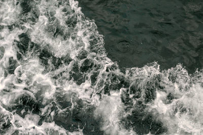 High angle view of water flowing in sea