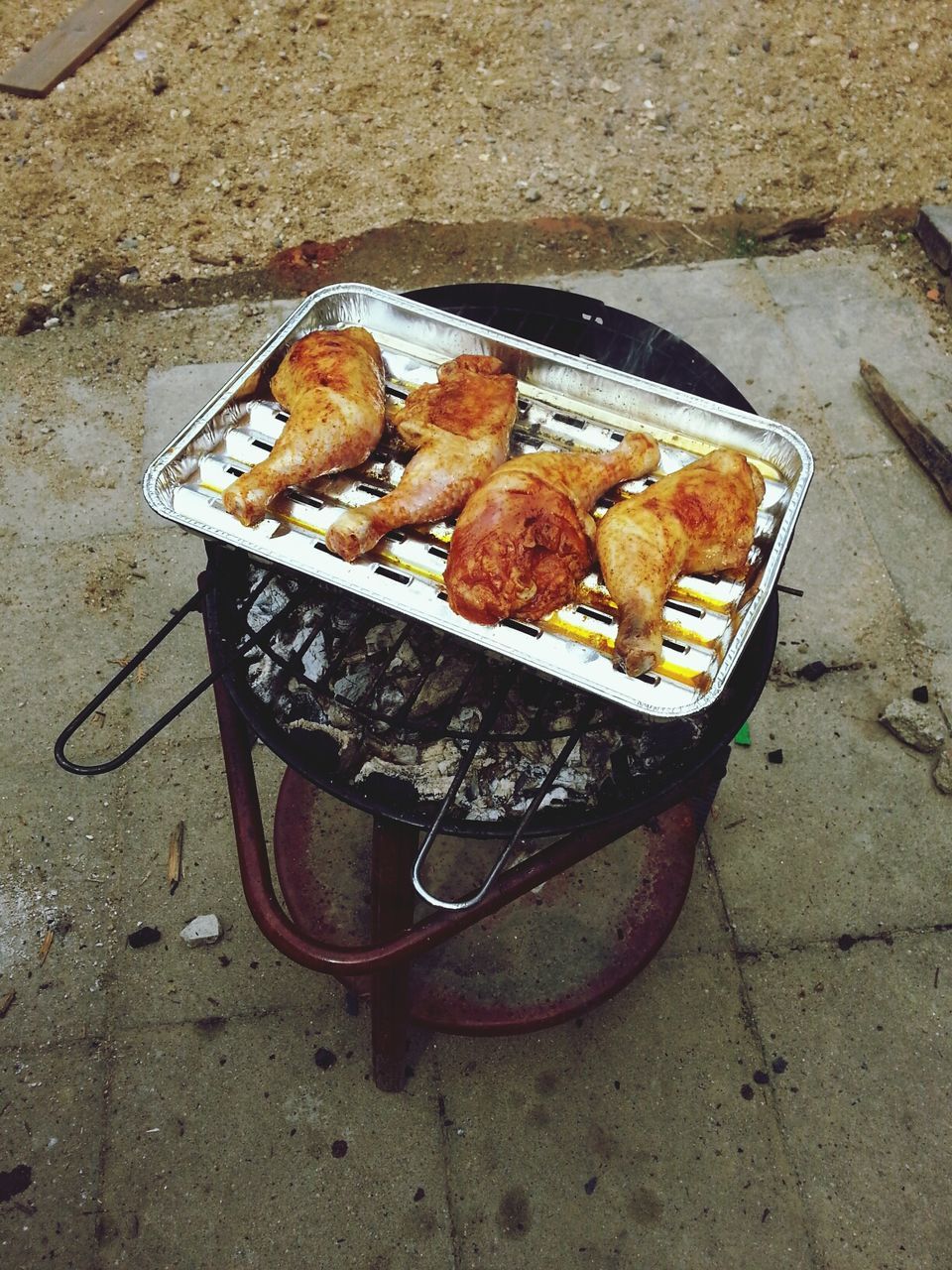 food, food and drink, high angle view, still life, freshness, no people, day, outdoors, close-up, metal, barbecue grill, sunlight, orange color, barbecue, preparation, healthy eating, wood - material, absence, dry, nature