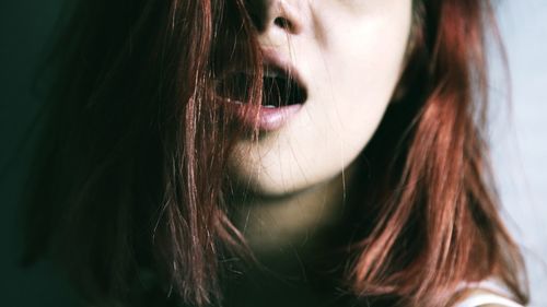 Close-up of woman with mouth open
