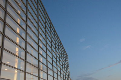 Low angle view of skyscraper against clear sky