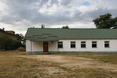 House on field against sky