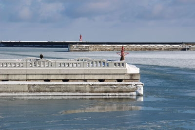 Pier over sea against sky