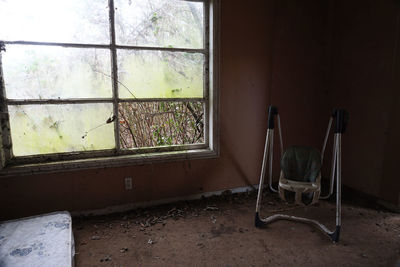 Abandoned glass window of old house