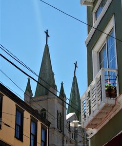 Low angle view of buildings against blue sky