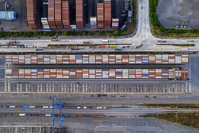 Aerial top view port warehouse with cargoes and containers.