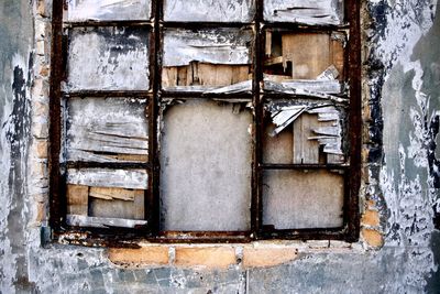 Closed window of abandoned house