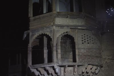 Low angle view of historical building at night