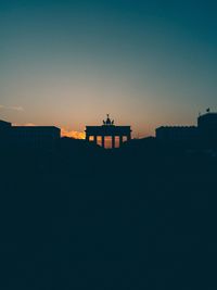 Low angle view of historical building against sky during sunset