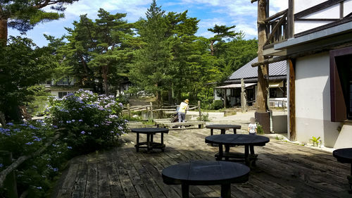 Chairs and table by building in yard