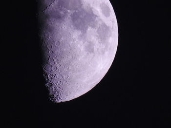 Low angle view of moon against clear sky at night