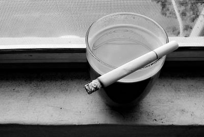 High angle view of cigarette on table