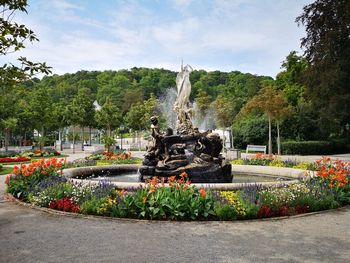 View of fountain in park against sky