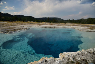 Scenic view of lake at yellowstone national park against sky