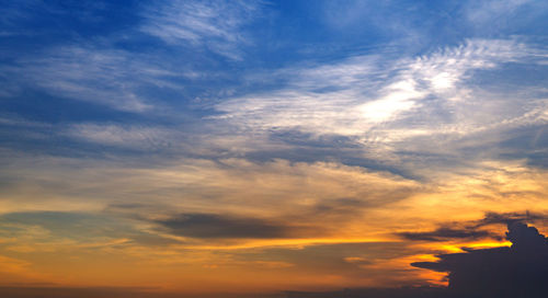 Low angle view of cloudy sky during sunset