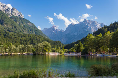 Scenic view of lake and mountains against sky