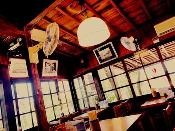 Low angle view of lantern hanging on ceiling of building