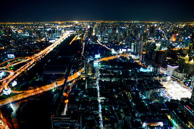 High angle view of illuminated city buildings at night