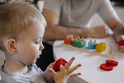 Close-up of boy playing with toy blocks