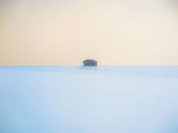 Scenic view of sea against clear sky during winter