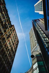 Low angle view of buildings against blue sky