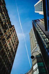 Low angle view of buildings against blue sky