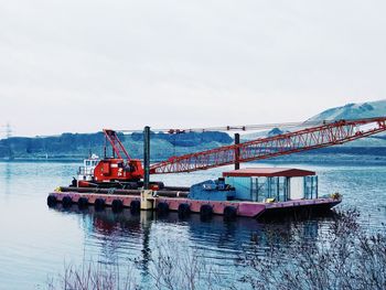 Bridge over river against sky