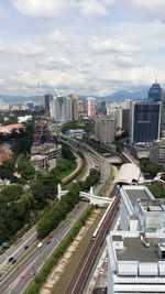 High angle view of street and buildings against sky