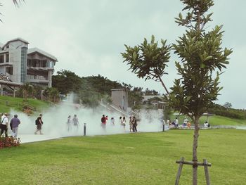 People in park against sky