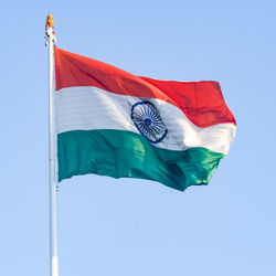 India flag flying high at connaught place with pride in blue sky, india flag fluttering, indian flag