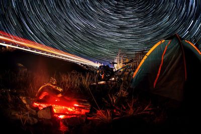 Light trails against sky at night