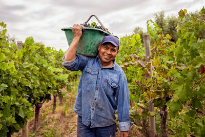 Portrait of smiling man standing in farm