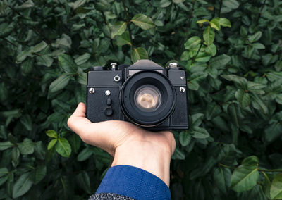 Close-up of hand holding camera