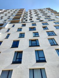 Low angle view of building against clear blue sky